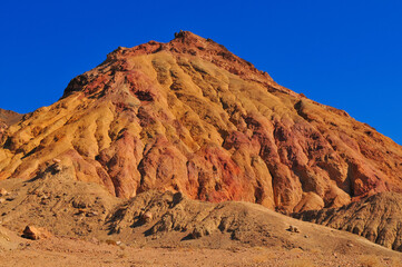 An eroded, pyramid-shaped hill on the Artists Drive scenic road, Death Valley National Park,...