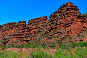 Red rock landscape on the scenic Cuesta de Miranda stretch of the famous Ruta 40 National Route, La...