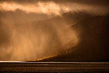 Dramatic morning light filtering through the clouds in Dyrafjördur, Westfjords, Iceland.