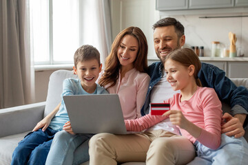 Family shopping online with credit card at home