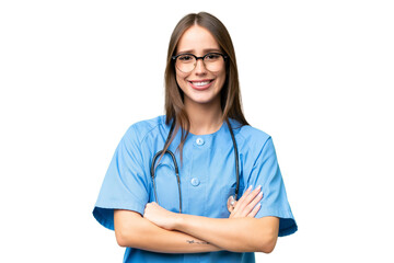 Young nurse caucasian woman over isolated background keeping the arms crossed in frontal position - obrazy, fototapety, plakaty