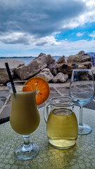 Drinking alcoholic beverages at touristic promenade Presernovo nabrezje at coastal town Piran,...