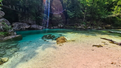 Turquoise creek of Soca river in Bovec, Triglav National Park, Slovenia. Magnificent Soca Valley in breathtaking Julian Alps. Wanderlust in untamed Slovenian Alps. Hiking amidst alpine wilderness