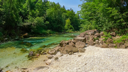 Turquoise creek of Soca river in Bovec, Triglav National Park, Slovenia. Magnificent Soca Valley in...