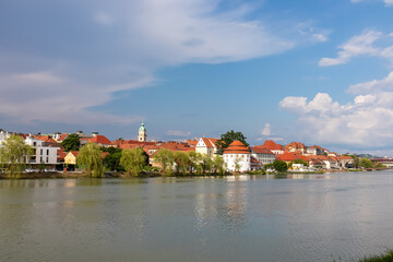 Naklejka na ściany i meble Breathtaking panorama of glistening Drava River as it gracefully winds its way through enchanting city of Maribor, nestled in heart of Slovenia, Europe. Timeless beauty of old town along riverbed