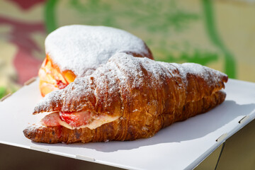 Dutch cuisine, fresh baked strawberry cake and croissant with cream and fresh fruits