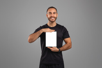 Man holding a tablet with blank screen