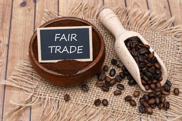 Coffee beans and coffee powder with the inscription “Fairtrade” on a label.