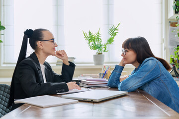 Mental therapy, session of smiling middle-aged female patient with psychological counselor
