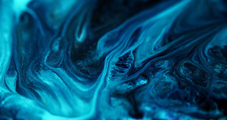 Fluid art. Glitter ink flow. Defocused blue black color shiny dust particles marble texture acrylic paint mix liquid emulsion spill abstract art background. - 779128715