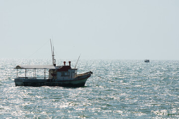 Boats resting in the sea on a sunset
