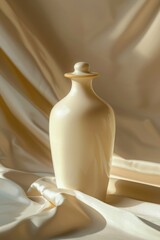 Simple white vase on a white cloth, perfect for home decor projects