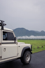 Fototapeta na wymiar A safari car drives through Baluran National Park, Indonesia