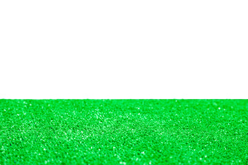 White or transparent empty apace at background over a close-up artificial grass surface.