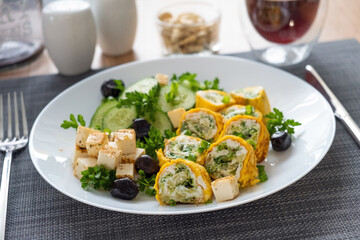 Healthy breakfast. Roll omelette, feta cheese and cucumber salad. Keto, ketogenic lunch. - 779142390