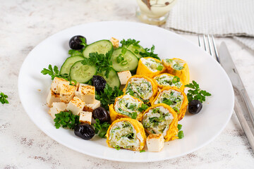 Healthy breakfast. Roll omelette, feta cheese and cucumber salad. Keto, ketogenic lunch. - 779142516