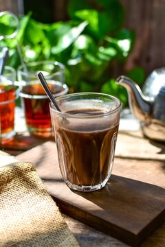 Hot cocoa, thai style traditional hot tea, background image, morning light	