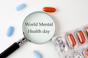 Depression and support concept. World mental health day through a magnifying glass on a white...