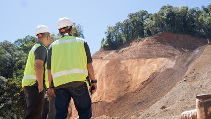 Inspectors observe road construction projects