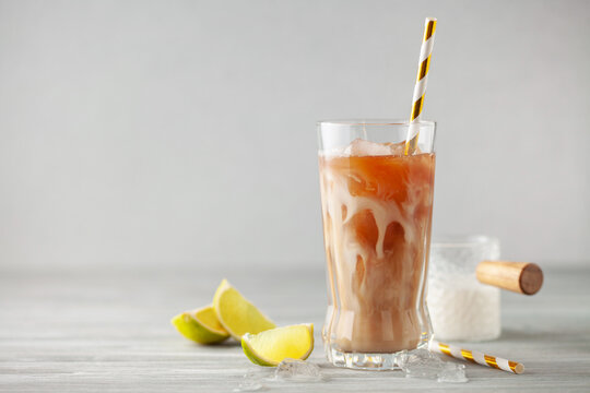 Homemade Cold Dirty Soda with  Coconut Cream, Ice and Lime. Alcohol free mocktail