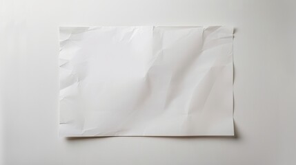 A crumpled blank white paper on a plain background