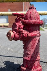 Old red fire hydrant in need of new paint