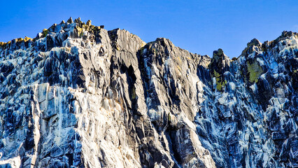 Nature's art: Close up of the spectacular cliffs of the Firth of Forth touching the clear blue summer sky, Isle of May Natural Nature Reserve, Scotland, UK