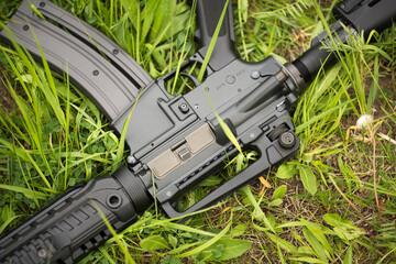 Automatic rifle in the grass
