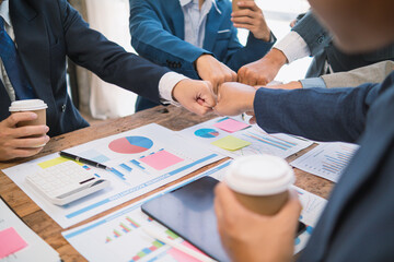 Businessmen and investors shake hands as symbol of joint venture after discussing, consulting and making contract to invest in business together. business people shaking hands as symbol of cooperation