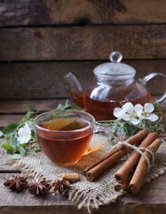 Obraz na płótnie Canvas tea on the table cinnamon sticks and herbal tea