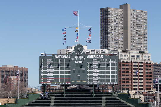 Wrigley Field center field scoreboard in the bleachers of the Chicago Cubs. Wrigley Field scoreboard is manually operated.