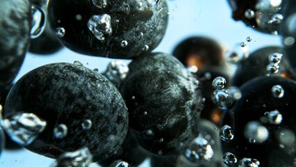 Macro shot of blueberries in the water. - 779203152