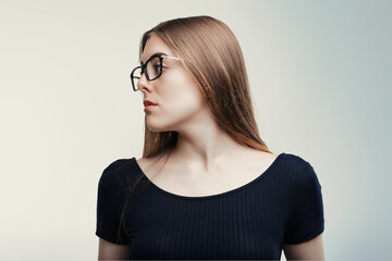 Contemplative woman, profile view, glasses accentuated