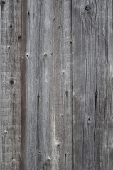 Texture of old rough wooden plank fence