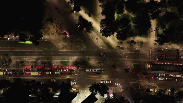Aerial slow-motion shots of nighttime traffic and cars on Mexico City's avenues