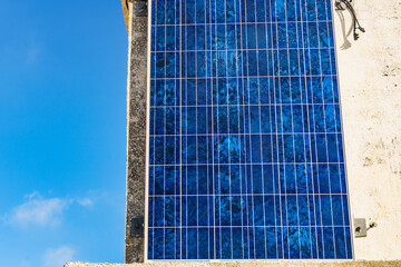 House wall with solar photovoltaic panel - 779216388