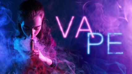 Woman smokes vape. Girl with electronic cigarette. Vape inscription near woman. Young lady in smoke from cigarettes. Female student vaping. Woman inhales smoke from vape. Vaper in purple light