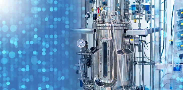 Bioreactor on blue. Scientific equipment. Bioreactor for conducting experiments. Technologies for production of medical drugs. Bioreactor for production of probiotics. Scientific technology