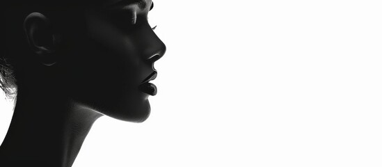 Silhouette of a woman with hair in a ponytail, shown in profile against a light background
