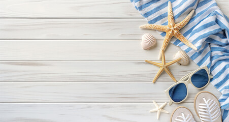  Summer vacation and travel concept. Sea star towel and sea star on a blue wooden table.