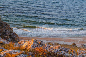 Sea with a rocky shore in the evening, view from above. Sea bay of Crimea