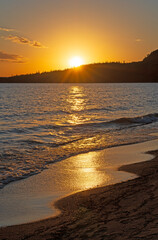 Golden Waves and a Golden Sun on a Great Lakes Beach