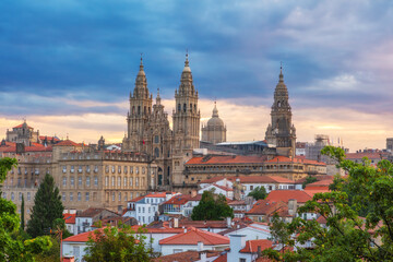 Aerial view of Santiago de Compostela city with Cathedral and buildings at sunrise, Galicia, Spain. Galician gothic church. Popular touristic landmark - 779232138