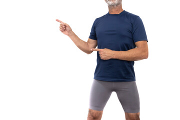 Mature man in sportswear, blue t-shirt and gray shorts, hairy legs, standing and looking forward,...