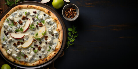 Top view of fruit and nut pizza with white sauce, mozzarella, pears, blue cheese, walnuts, and honey, with copy space, dark concrete background Menu concept. Delicious tasty Italian food diet