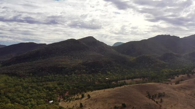 Aerial panning along Wilpena Pound rock formation in Flinders ranges of South Australia.
