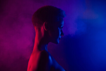 Profile side photo of girl look on blue bright empty space background with neon misty effect