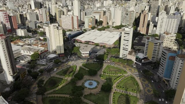 Drone flies high over Pra&ccedil;a Raul Soares and Mercado Central at sunset in Belo Horizonte