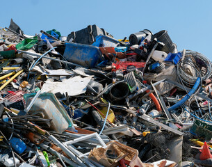 Heap of waste plastic products at recycling centre