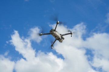 An unmanned aerial vehicle or quadcopter drone that flies with four rotors